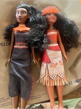 Pair of Fashion Dolls Moana and Matangi Dolls and Moana Light Up Necklace Bundle